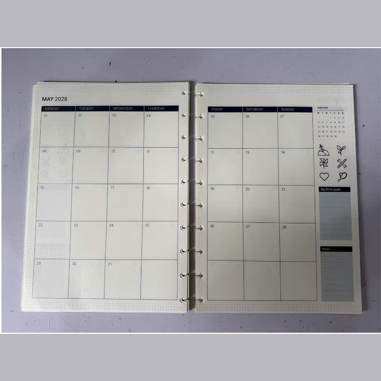 Printed sample of the 2027/2028 monthly calendar refill – open spread, side view