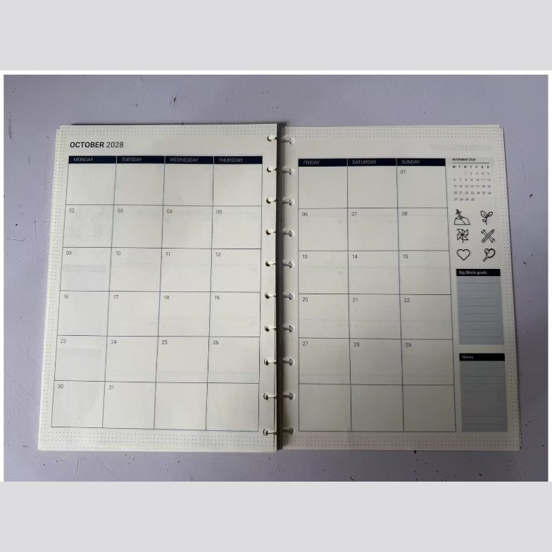 Printed sample of the 2027/2028 monthly calendar refill – open spread, close view