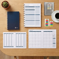 The Work Kit contents — notebook, AM/PM weekly, daily refill, sticky notes and dividers