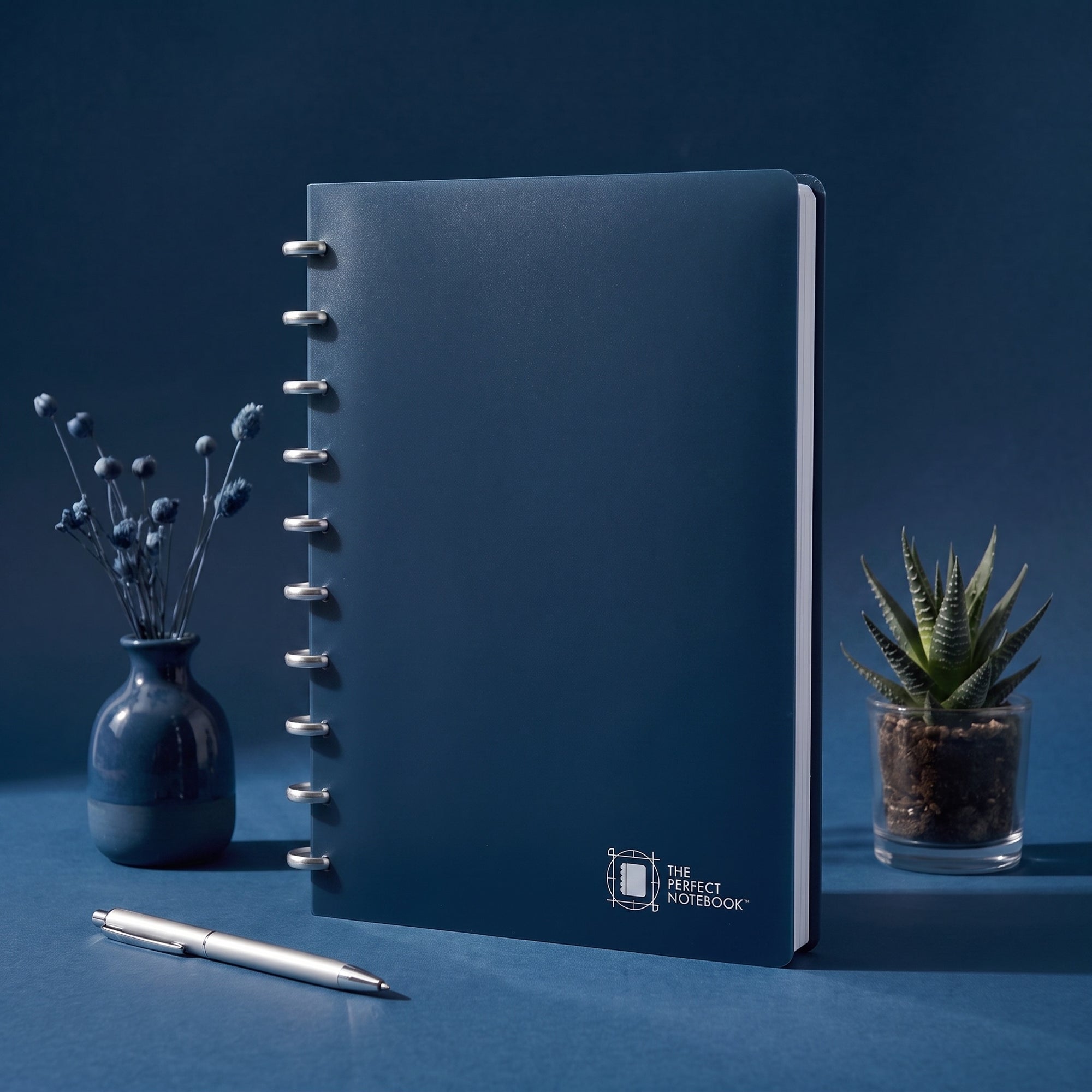 The Perfect Notebook — navy disc-bound notebook on a desk