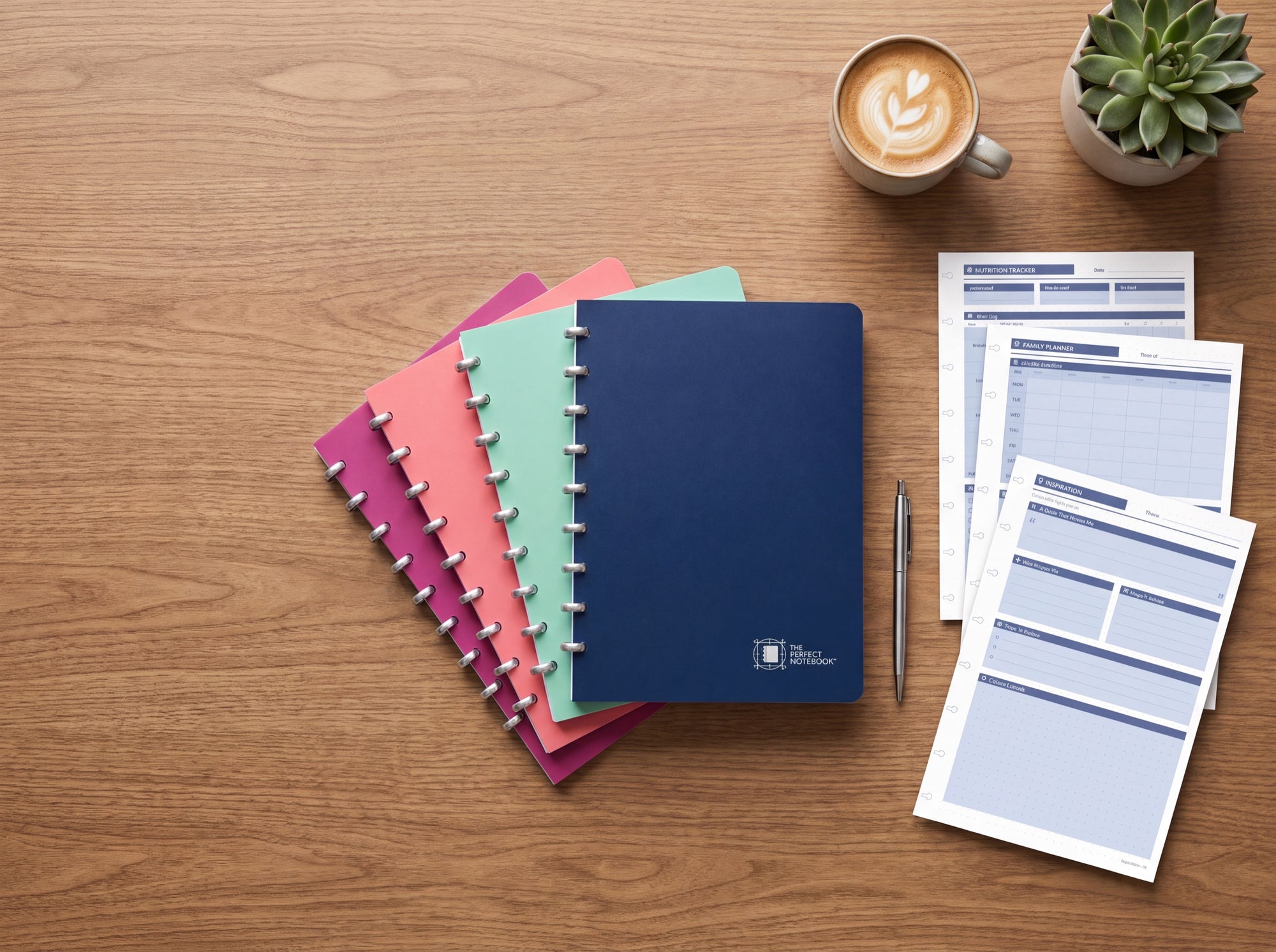 Fanned notebooks with refill pages and coffee — Never run out