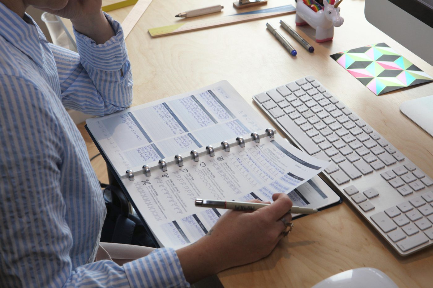 A Daily Page open on a desk — the icon row circled and coloured while working